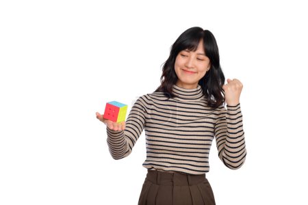 Photo for Solving cubic problems, problem solution and making strategic moves concept. Asian woman holding a puzzle cube standing on white background. - Royalty Free Image