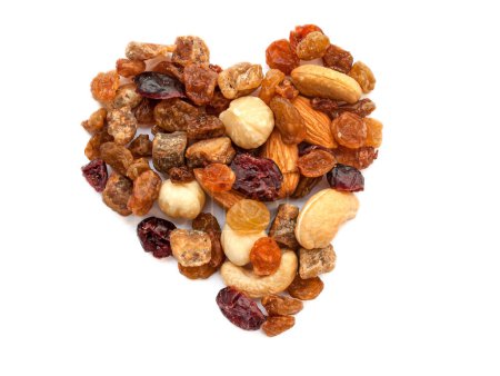 Photo for Heart made of nuts and dried fruits on a white background with copy space. - Royalty Free Image