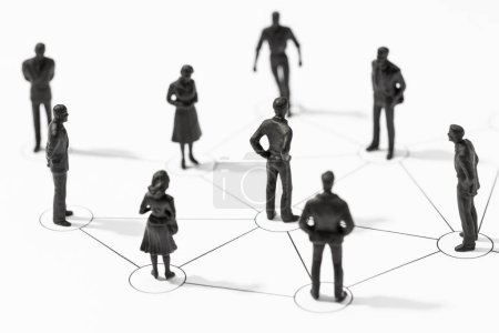Group of Linked people figurines. Communication, teamwork, community, society, social network concept mug #631676652