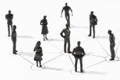 Group of Linked people figurines. Communication, teamwork, community, society, social network concept mug #631676652