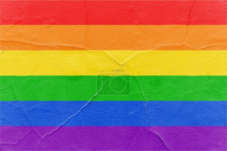 Foto de Pride rainbow flag painted on cracked textured wall. Outdoor Grunge texture background - Imagen libre de derechos