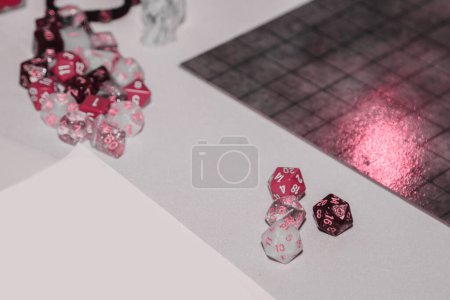 Photo for A set of polyhedral dice used for role playing games such as Dungeons Dragons. A fresh classic for 2023 in Viva Magenta. Color concept of the year - Royalty Free Image