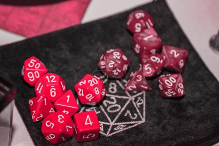 Photo for A set of polyhedral dice used for role playing games such as Dungeons Dragons. A fresh classic for 2023 in Viva Magenta. Color concept of the year - Royalty Free Image