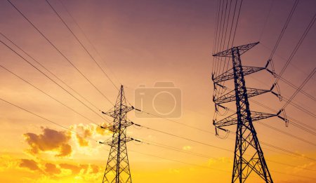Photo for Silhouette of high voltage electrical pole structure - Royalty Free Image