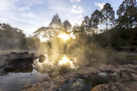 Hot springs and fog in Thailand with sunlight at morning