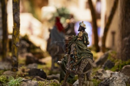 Photo for Figurine of the wise man Balthasar on a camel nativity scene figures, in a nativity scene, in Borja, Zaragoza, Spain - Royalty Free Image