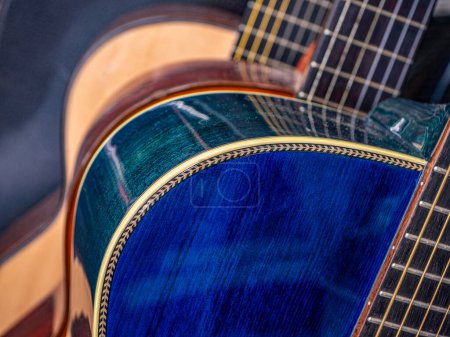 Photo for Close Up of Spruce Guitar Top and Binding or Purfling , Blue color on toip and green color back side - Royalty Free Image