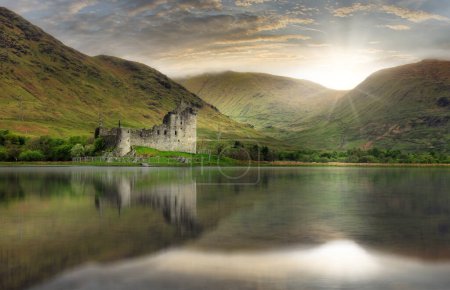 Photo for Kilchurn Castle with reflection in water at dramatic sunset, Nice Scotland landscape - Royalty Free Image