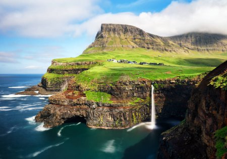 Photo for Faroe Islands waterfall Mafossur near village Gasadalurron the Island Vgar. Green mountain caost landscape. - Royalty Free Image