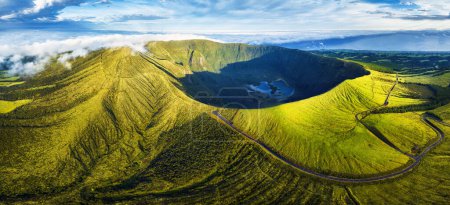 Panorama of drone green sunrise landscape of volcano Gordo caldera in Faial island - Azores, Portugal
