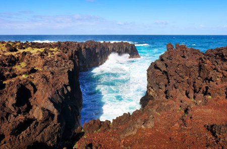 Waves on coast at A Porta do Diabo in Sao Miguel, the Azores - Atlantic ocean landscape with cliff