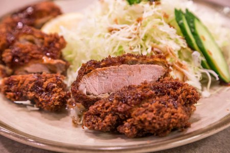 Photo for Tonkatsu - Japanese deep-fried pork cutlet with shredded cabbage - Royalty Free Image