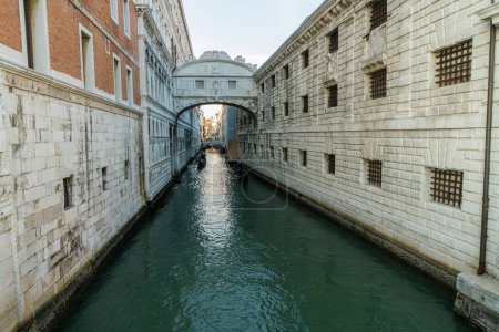 Photo for The Bridge of Sighs - famous bridge connects the Doges Palace to the prison, in Venice, Italy with gondolas - Royalty Free Image