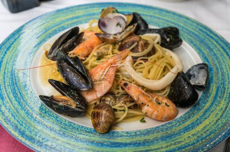 Close up Italian seafood pasta with shrimps, mussels and clams