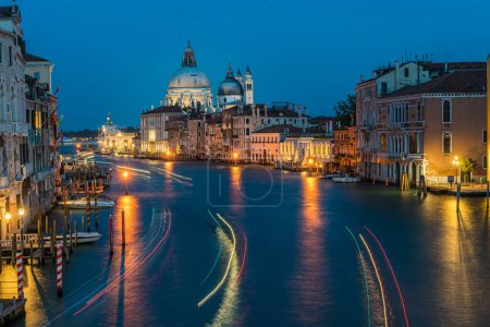 Photo for View of Basilica di Santa Maria della Salute and grand canal from Accademia Bridge at night in Venice, Italy. - Royalty Free Image