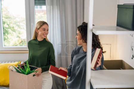 Photo for Female college student move in dorm. they are talking in the room - Royalty Free Image