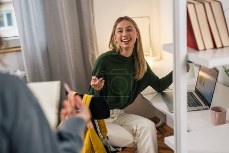 Photo for College female friends talking in dorm room - Royalty Free Image
