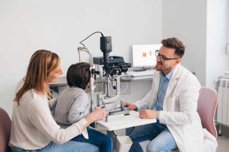 Photo for Mom brings son to an eye examination - Royalty Free Image