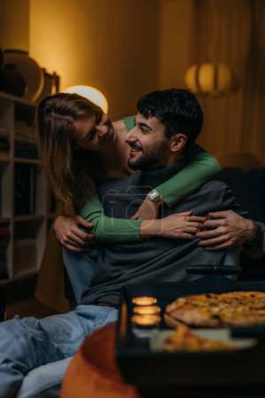 Photo for Loving woman hugs her man from behind - Royalty Free Image