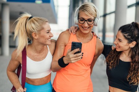 Photo for Three close friends hang out after gym - Royalty Free Image