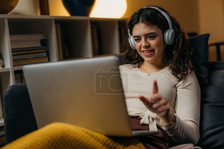 Photo for A Caucasian woman is having an online lecture - Royalty Free Image