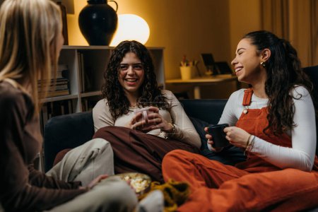 Photo for Three women are hanging out in the evening - Royalty Free Image