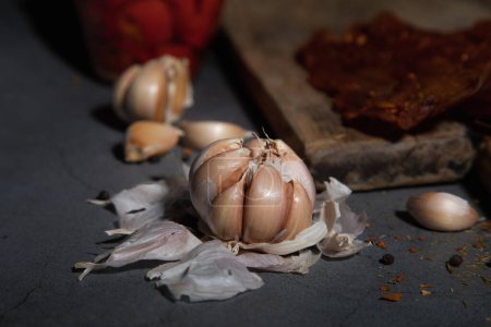 garlic on dark background, spices for food aroma