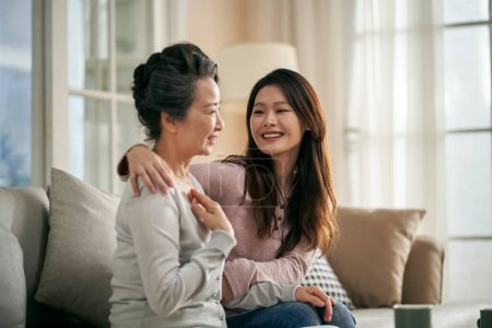 Photo for Happy senior asian mother and adult daughter having a good time at home - Royalty Free Image