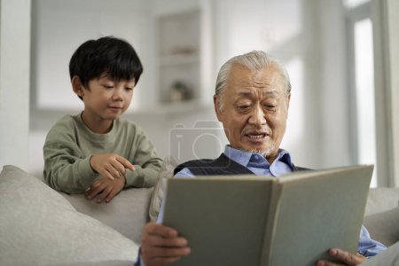 Photo for Senior asian grandfather having a good time with grandson at home - Royalty Free Image