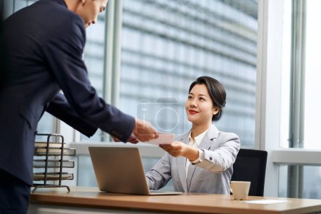 Photo for Young asian female business manager working in modern office - Royalty Free Image