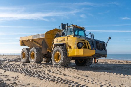 Photo for On the beach, there's a schanier dumper on a sunny day - Royalty Free Image