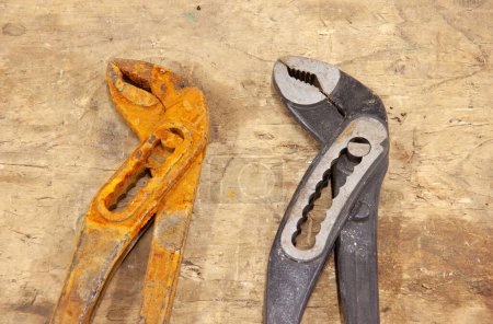 Photo for Different thirty-six inches of water pliers ,one has been in water for a while - Royalty Free Image
