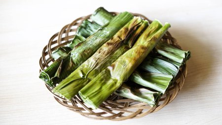 Indonesian traditional food is called otak otak. food made from minced mackerel wrapped in banana leaves, grilled, and served with spicy sour sauce.