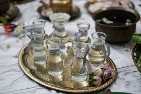 water in a bottle one of the elements for a traditional event before marriage is called siraman.JPG
