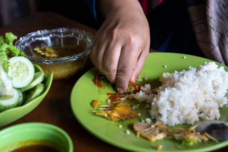 people eat rice complete. people eat Sundanese food