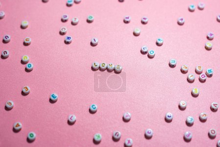Photo for Conceptual beautiful love and compassion concept made with Colorful Alphabetical Beads - Royalty Free Image