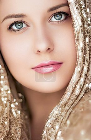 Beauty, luxury fashion and glamour, woman dressed in gold, portrait