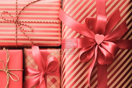 Holiday gifts and wrapped luxury presents, coral gift boxes as surprise present for birthday, Christmas, New Year, Valentines Day, boxing day, wedding and holidays shopping or beauty box delivery