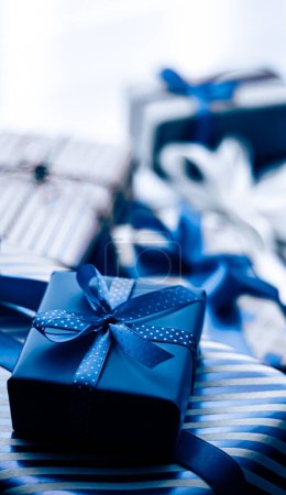 Holiday gifts and wrapped luxury presents, blue gift boxes as surprise present for birthday, Christmas, New Year, Valentines Day, boxing day, wedding and holidays shopping or beauty box delivery
