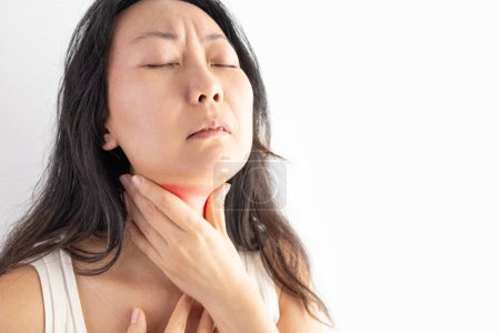 Photo for COVID-19 Coronavirus woman having symptoms signs: Sore throat, Asian woman with pain in neck on white background. - Royalty Free Image