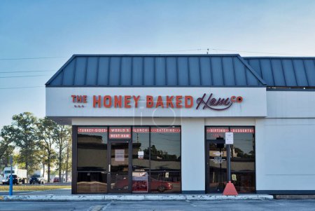 Photo for Houston, Texas USA 10-27-2022: The Honey Baked Ham store exterior in Houston, TX. American food retailer selling sliced deli meats and desserts. - Royalty Free Image