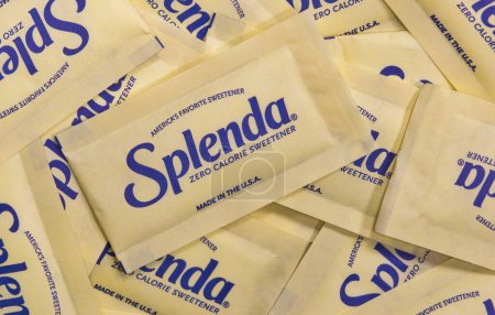 Photo for Houston, Texas USA 12-04-2022: Splenda zero calorie sweetener packets scattered loosely. Global sugar substitute brand. Flat lay isolated macro image. - Royalty Free Image