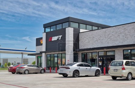 Photo for Houston, Texas USA 03-19-2023: Swift gas station and convenience store storefront exterior with parked vehicles in Houston, TX. - Royalty Free Image