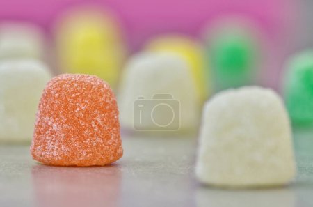 Photo for Gum Drops sugar coated candy jubes, side view macro spaced on a table with selective focus. Popular traditional gelatin based candies made worldwide. - Royalty Free Image