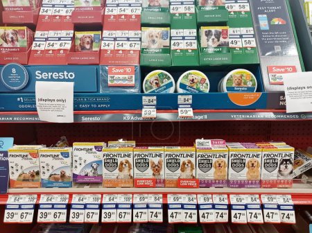 Photo for Houston, Texas USA 09-10-2021: Assorted flea treatment brand name products displayed on shelves in a pet store with prices. - Royalty Free Image