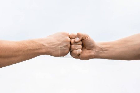 Photo for Teamwork and friendship. Partnership concept. Man giving fist bump. Bumping fists together. Fist Bump. Clash of two fists. Concept of confrontation, competition. Gesture of giving respect or approval. - Royalty Free Image