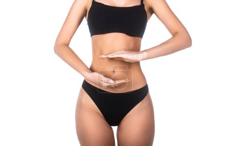 Photo for Woman, stomach, ache. Health care concept, closeup. Young multi-ethnic womans stomach. Closeup woman hands made protect shape stomach. Stomach bowel good digestion food womans medical health. - Royalty Free Image