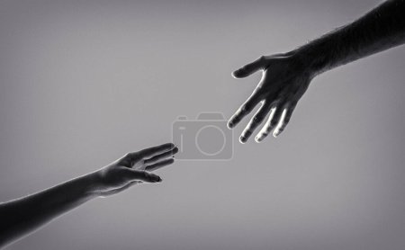Photo for Helping hand outstretched, isolated arm, salvation. Two hands, helping arm of a friend, teamwork. Black and white. - Royalty Free Image