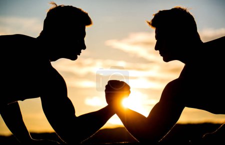 Photo for Two men arm wrestling. Rivalry, vs, challenge, hand wrestling. Rivalry, closeup of male arm wrestling. Men measuring forces, arms. - Royalty Free Image
