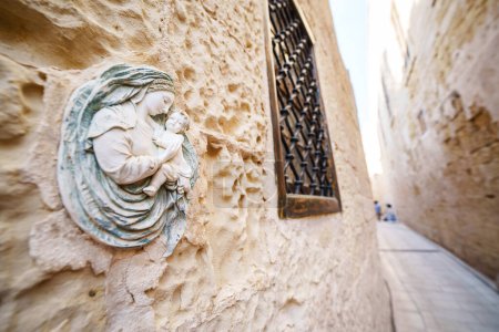 Photo for Religious Virgin Mary figure on a house wall in Malta Island. - Royalty Free Image